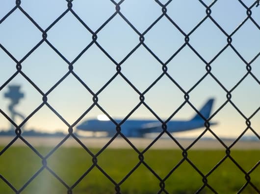 Security fence with view to airport