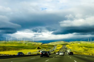 Road with wind turbines in background