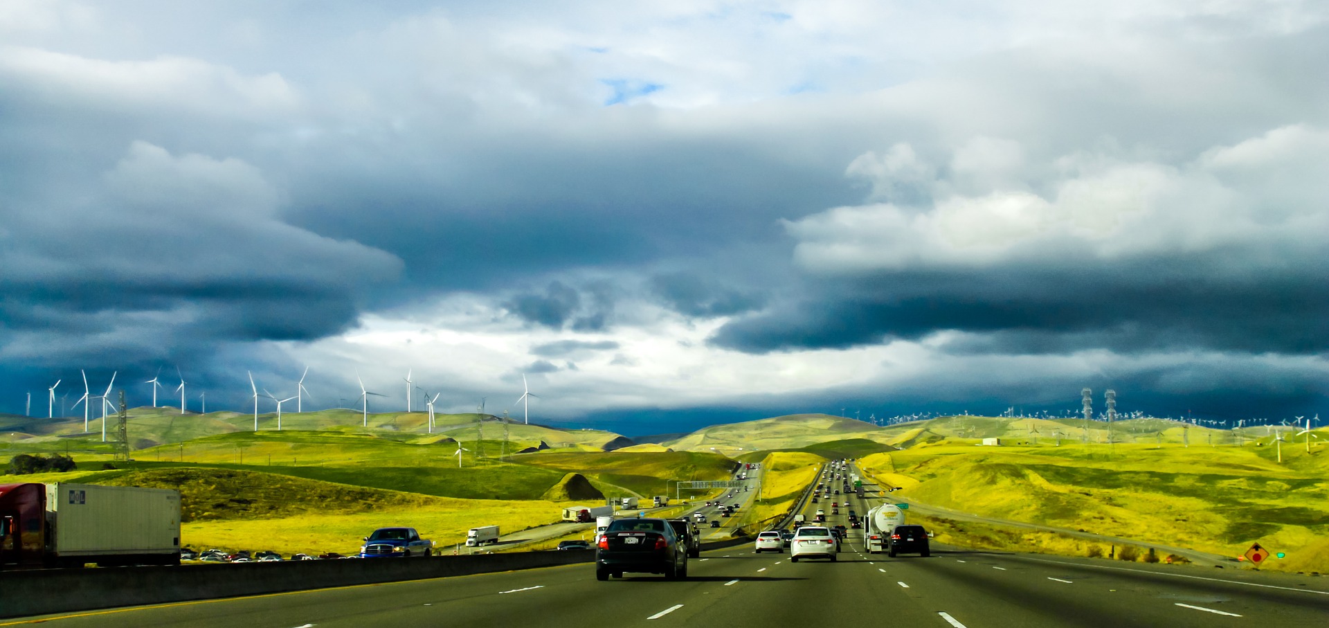 Road with wind turbines in background